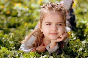 little girl squinting outside. Vision therapy near you at New Baltimore Optometry